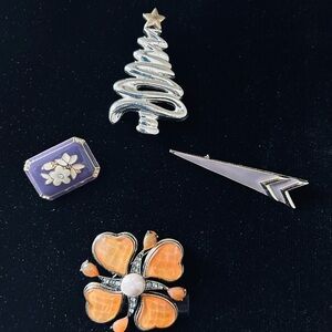 Set of 4 costume jewelry pins.